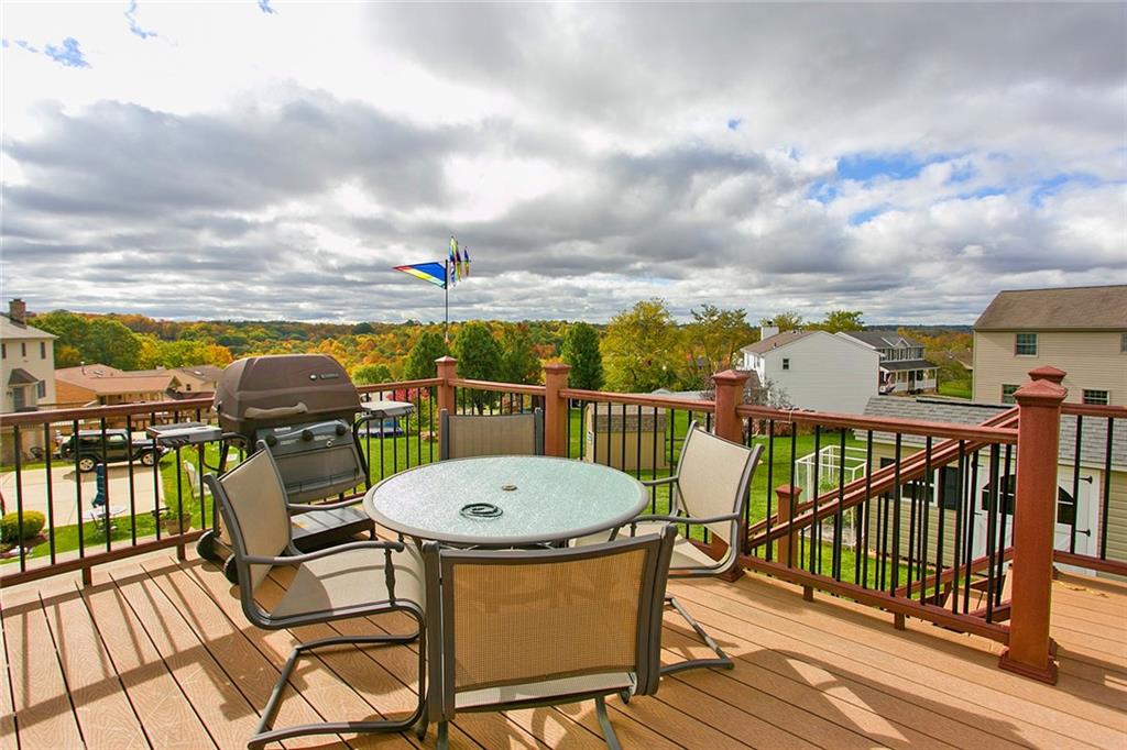 83 Rustic Ridge Drive Pittsburgh, PA 15239 - Photo 14 of 25 Enjoy outdoor dining or relax with your favorite beverage on the trex deck that is located off of the sun room. The deck has stairs to the rear yard and driveway