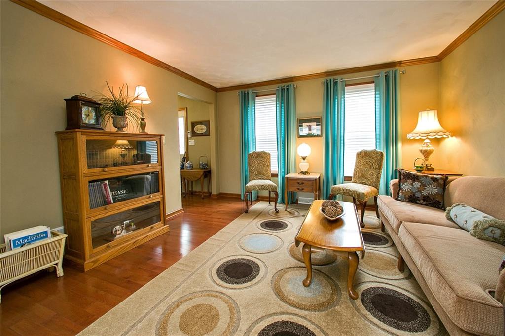 83 Rustic Ridge Drive Pittsburgh, PA 15239 - Photo 5 of 25 The Living Room has Oak Hardwood Flooring & Tall Windows for Natural Light