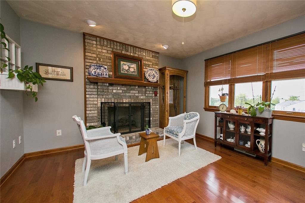 83 Rustic Ridge Drive Pittsburgh, PA 15239 - Photo 8 of 25 The Family Room Features and a Brick Fireplace