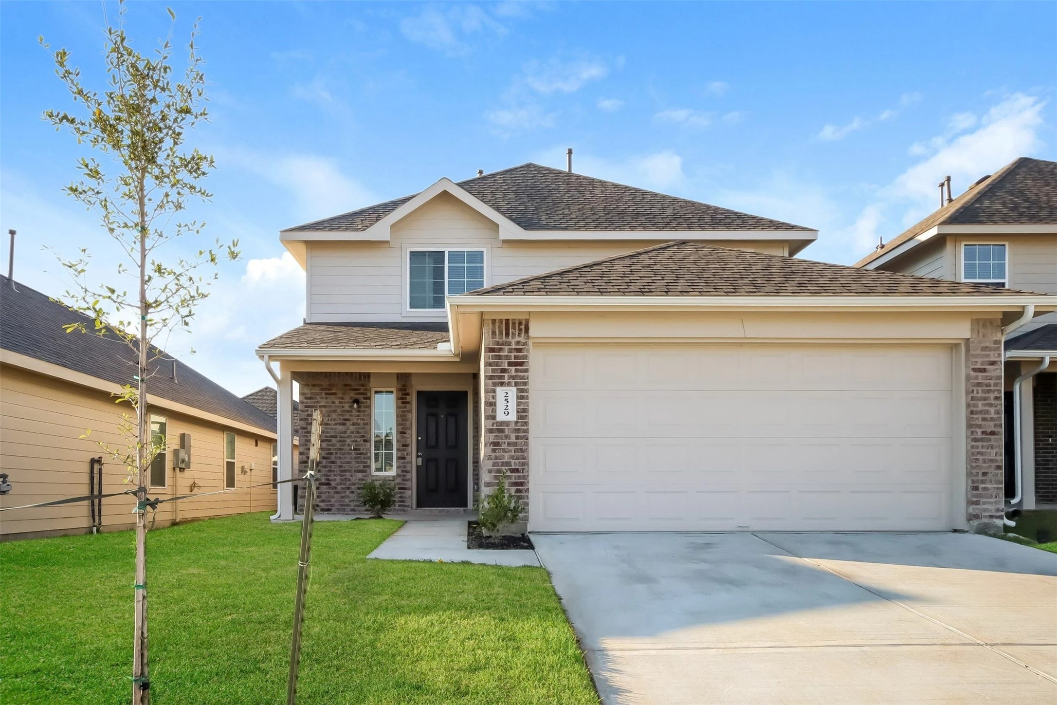 a front view of a house with a yard