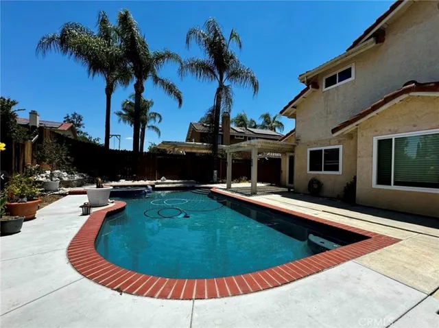 a view of a swimming pool with a lounge chairs