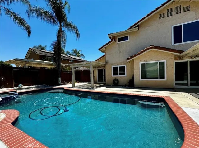 a front view of house with yard and outdoor seating