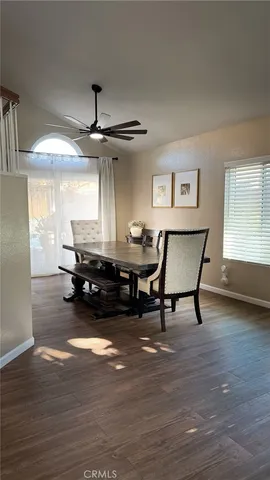 a room with wooden floor and a table
