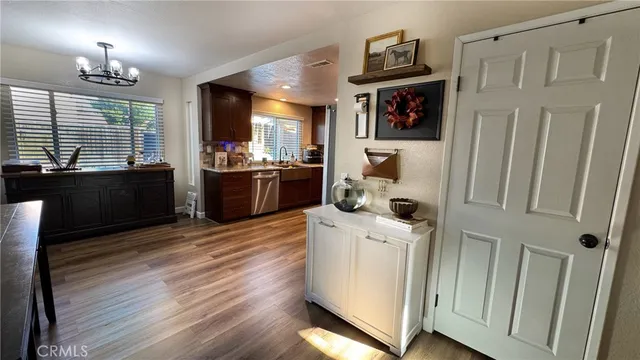 a kitchen with a stove and a refrigerator