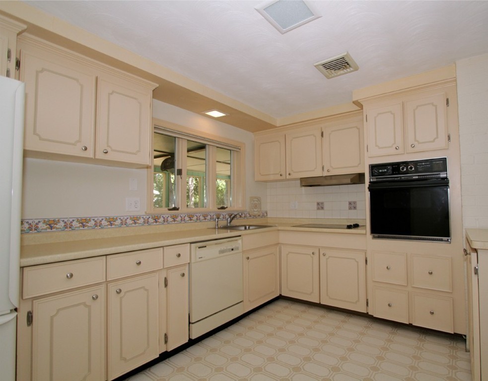 15 Temi Road Framingham, MA 01701 - Photo 3 of 13 a kitchen with white cabinets