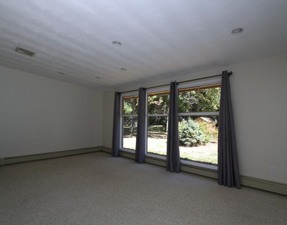 15 Temi Road Framingham, MA 01701 - Photo 4 of 13 an empty room with windows