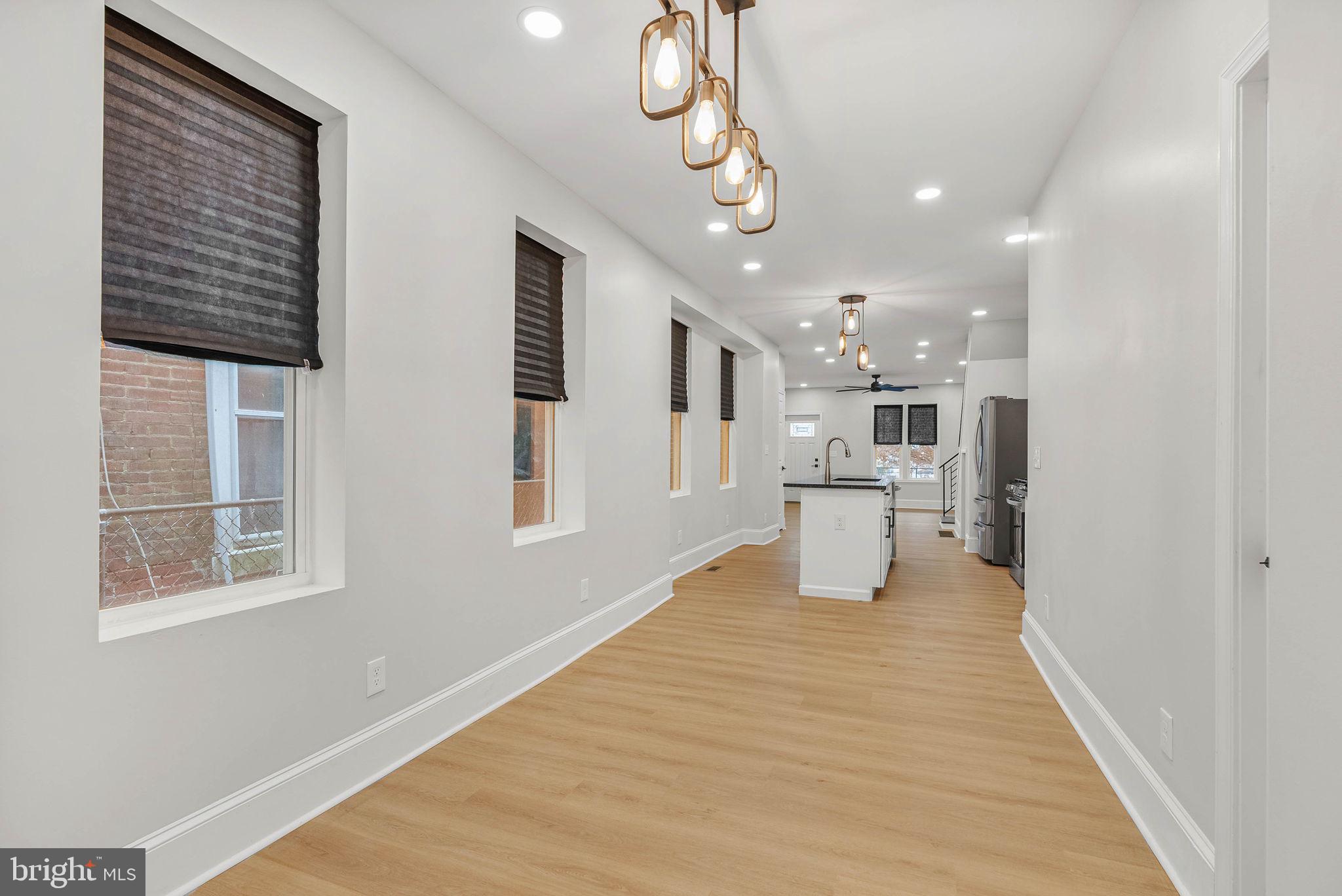 5737 Springfield Avenue Philadelphia, PA 19143 - Photo 16 of 31 a view of a kitchen with a sink and windows