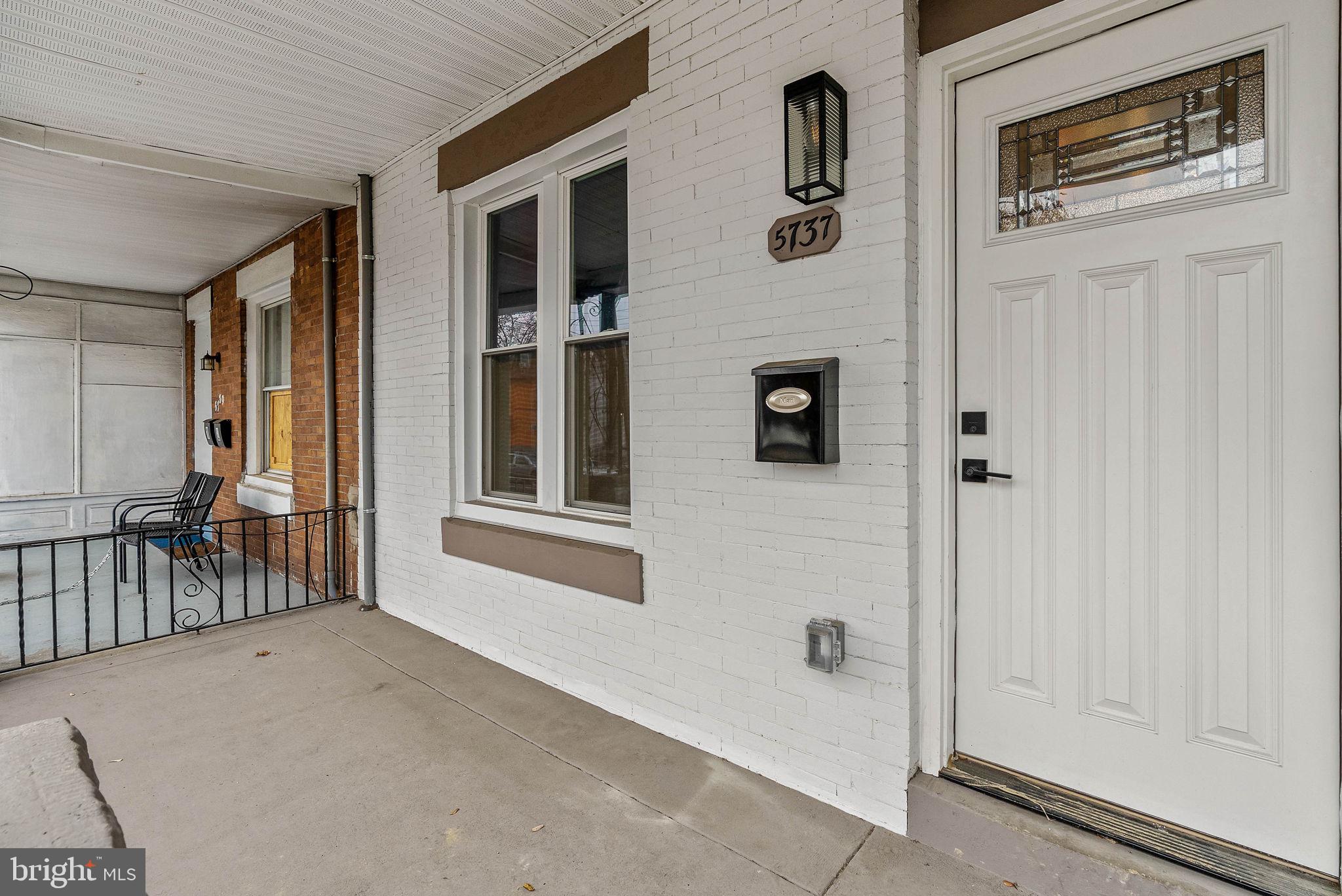 5737 Springfield Avenue Philadelphia, PA 19143 - Photo 2 of 31 a view of a hallway with windows and entryway