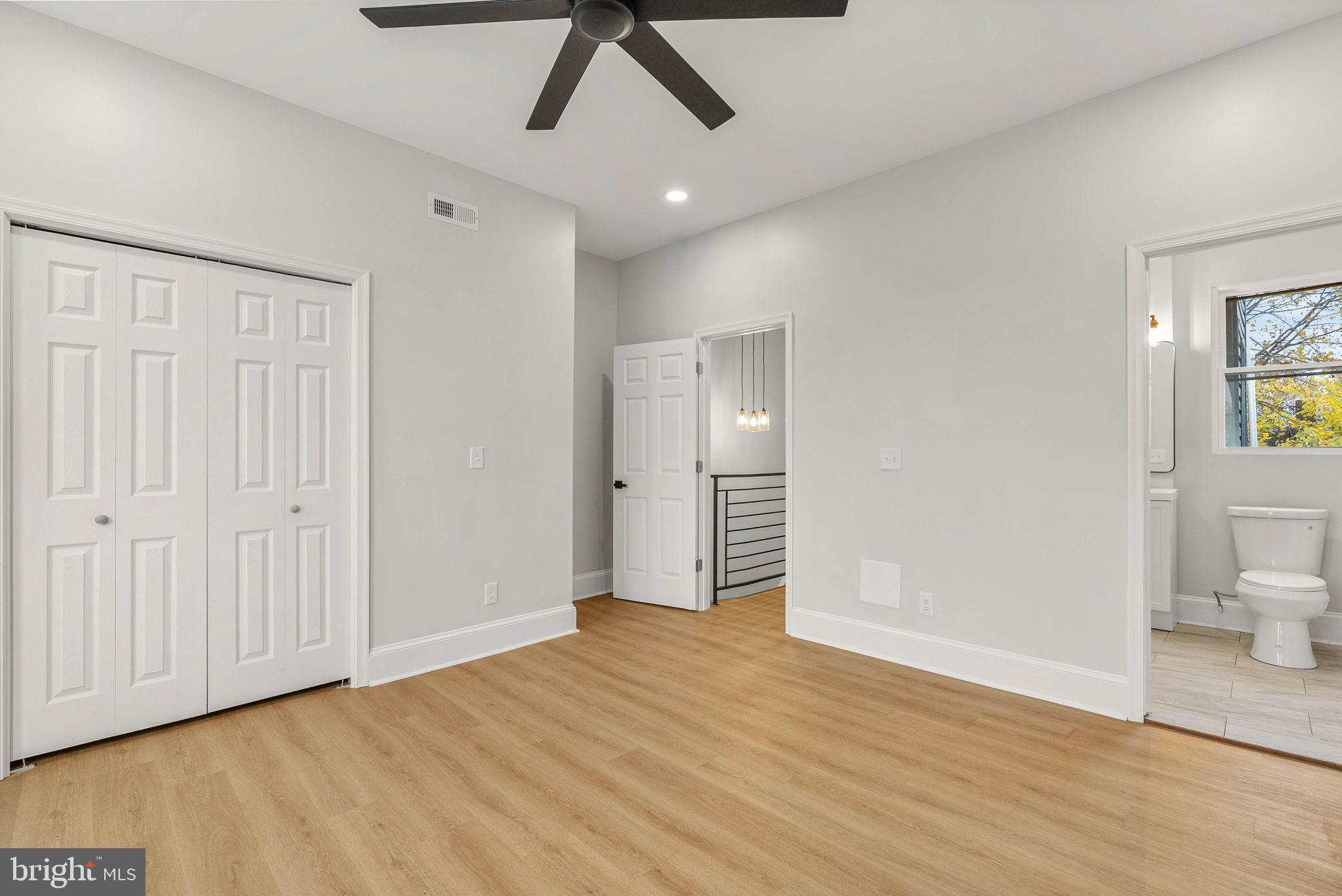 5737 Springfield Avenue Philadelphia, PA 19143 - Photo 22 of 31 a view of empty room with wooden floor and fan