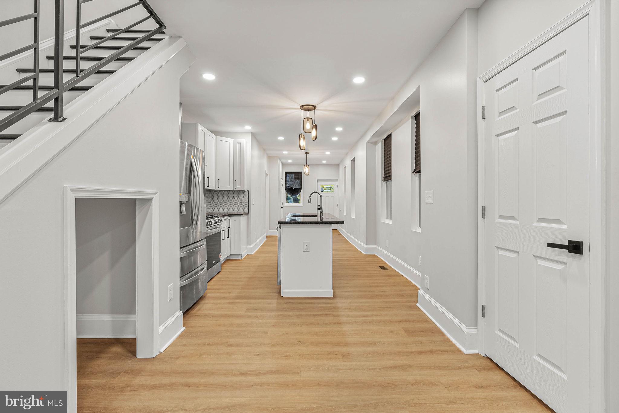5737 Springfield Avenue Philadelphia, PA 19143 - Photo 8 of 31 a view of kitchen with wooden floor