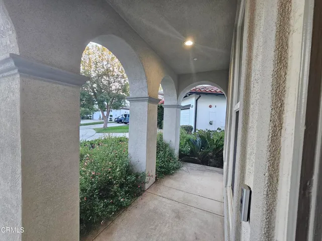 a view of hall way with furniture