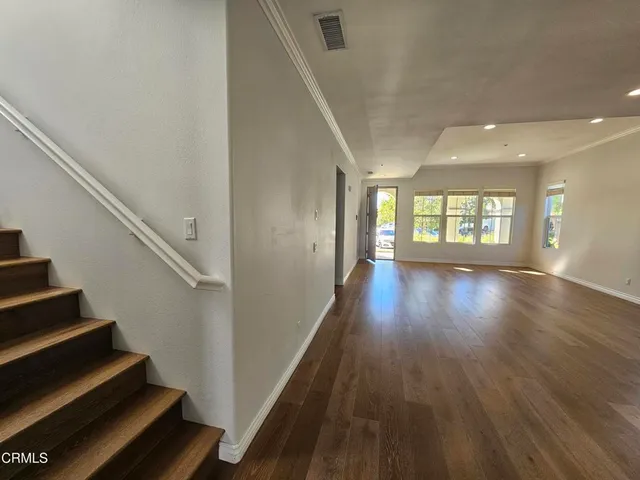a view of an entryway with wooden floor