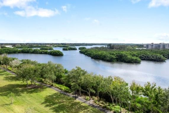 9957 Key Haven Road Seminole, FL 33777 - Photo 25 of 27 a view of a lake with houses in the back