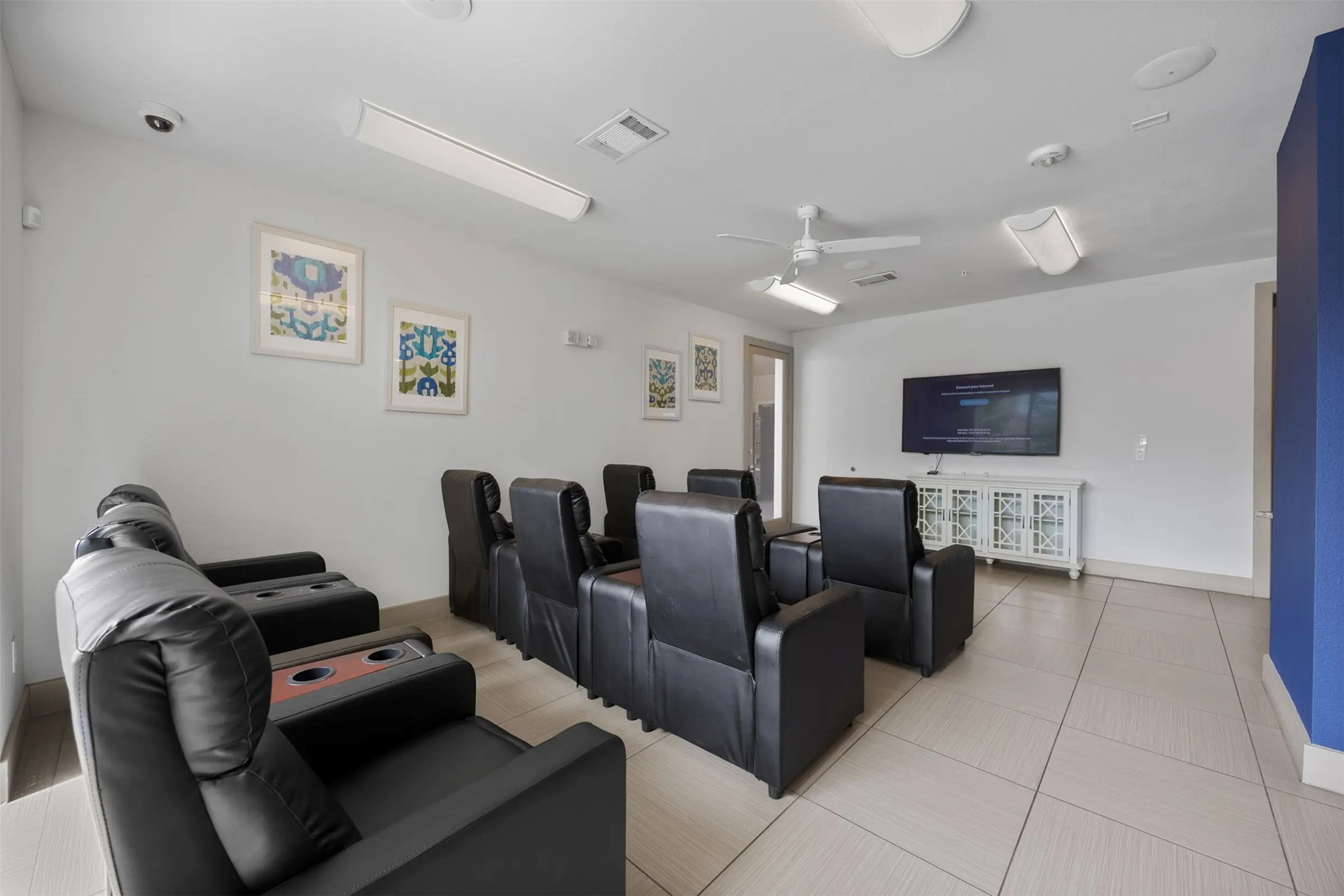 6725 Circle S Road, Unit B1257 Austin, TX 78745 - Photo 17 of 23 a living room with furniture a flat screen tv and a couch