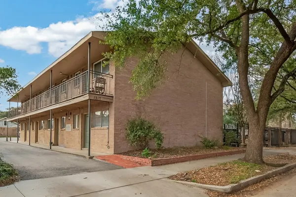 a view of a building with a tree