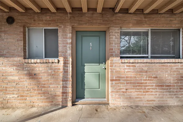 front view of a brick house with a door