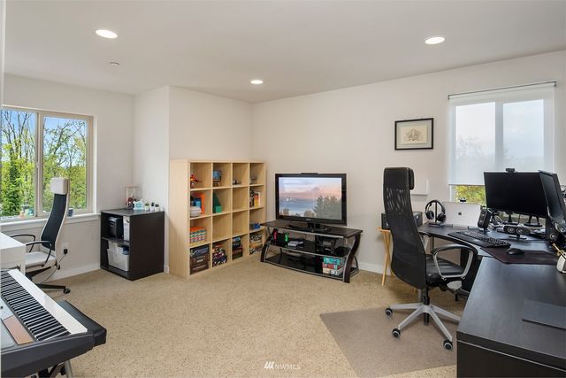 a living room with a couch and a window