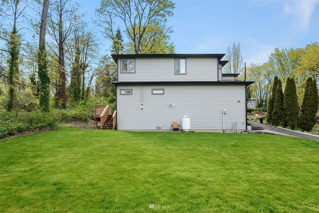 a balcony with wooden floor and outdoor space