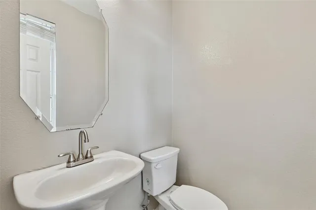 a kitchen with stainless steel appliances granite countertop a stove top oven a sink a counter top space and cabinets