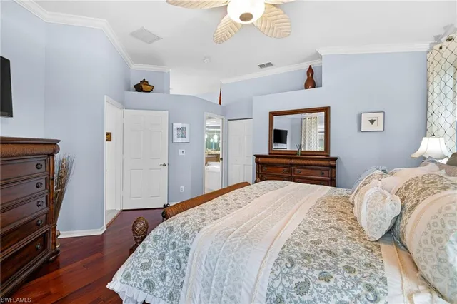 a large bathroom with a granite countertop double vanity sink a bathtub and shower