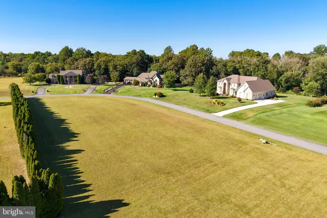 an aerial view of a swimming pool with outdoor space