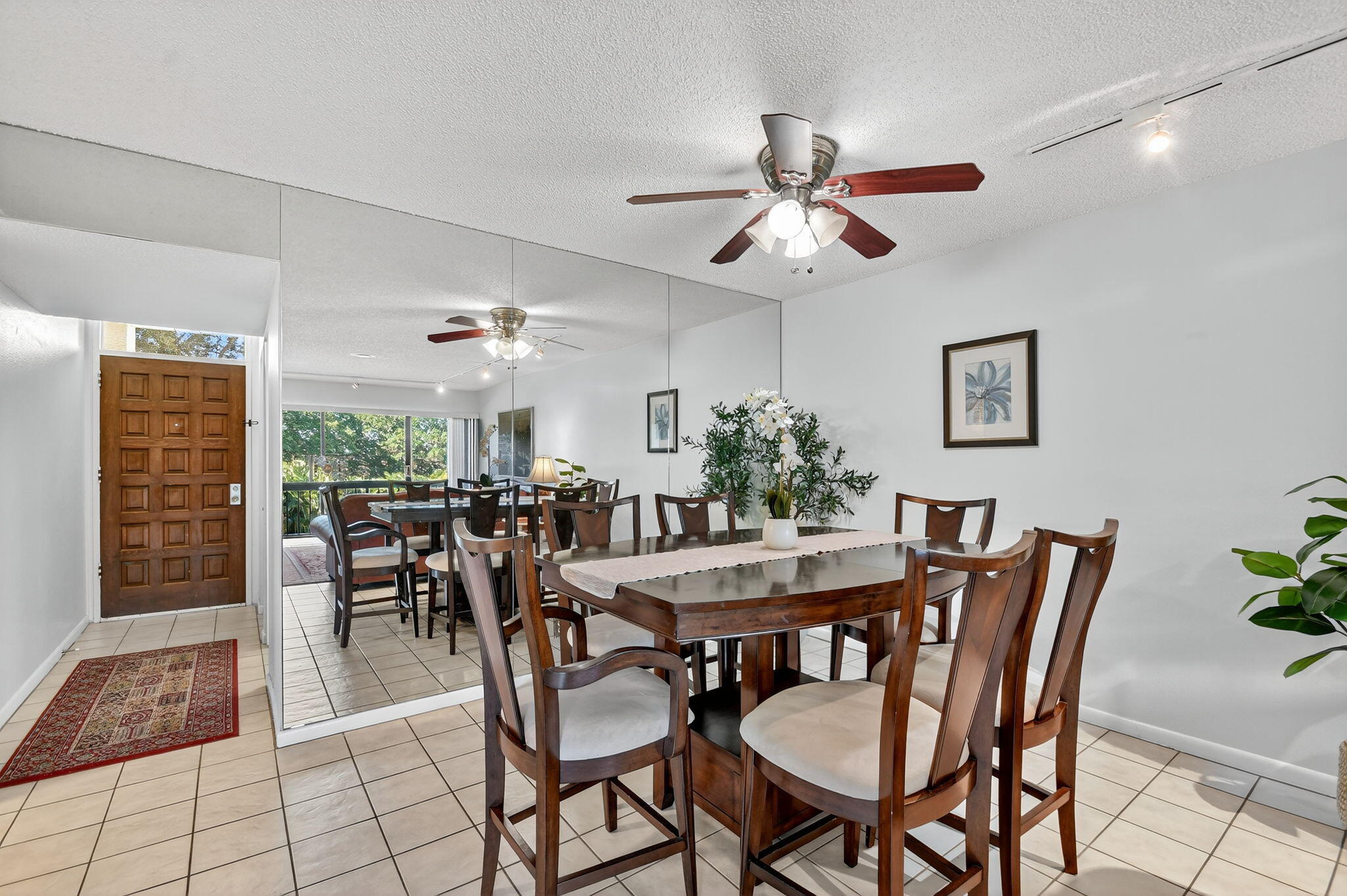 2500 Presidential Way, Unit 302 West Palm Beach, FL 33401 - Photo 12 of 52 a dining room with furniture and window