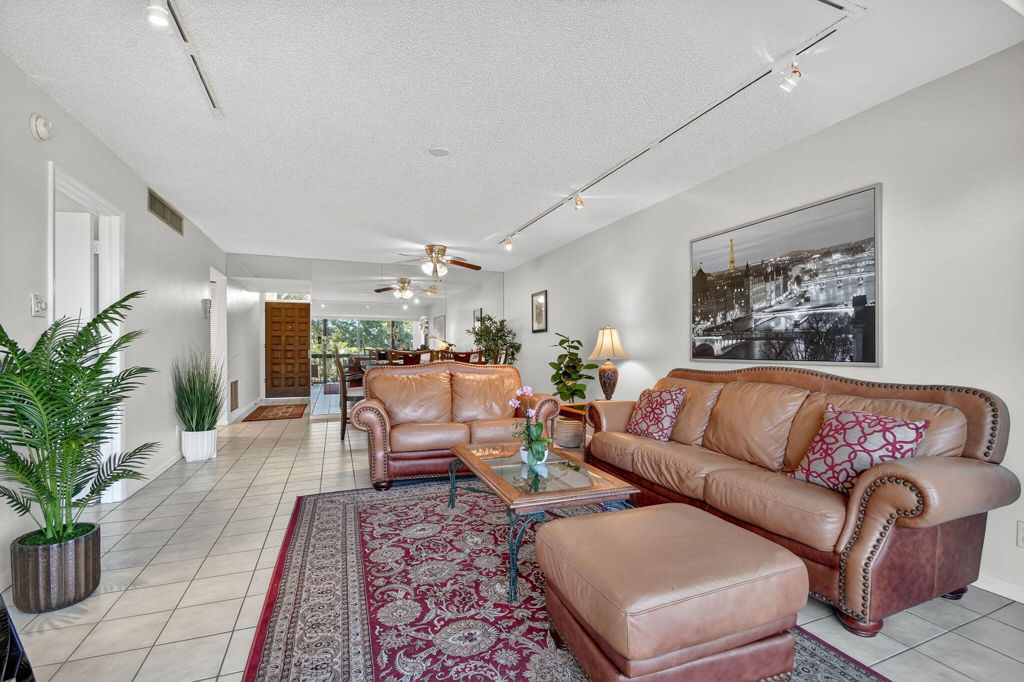 2500 Presidential Way, Unit 302 West Palm Beach, FL 33401 - Photo 17 of 52 a living room with furniture or couch and a potted plant