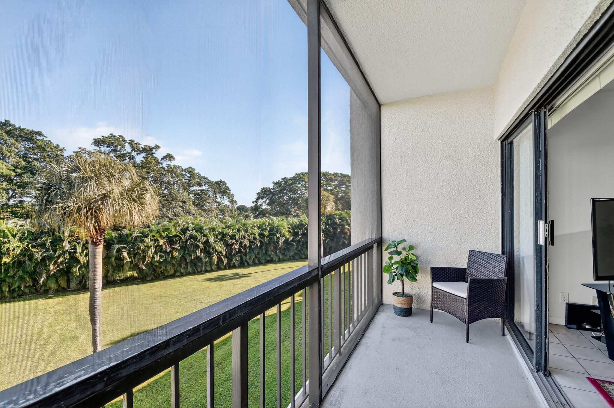 2500 Presidential Way, Unit 302 West Palm Beach, FL 33401 - Photo 22 of 52 a view of a balcony with chairs