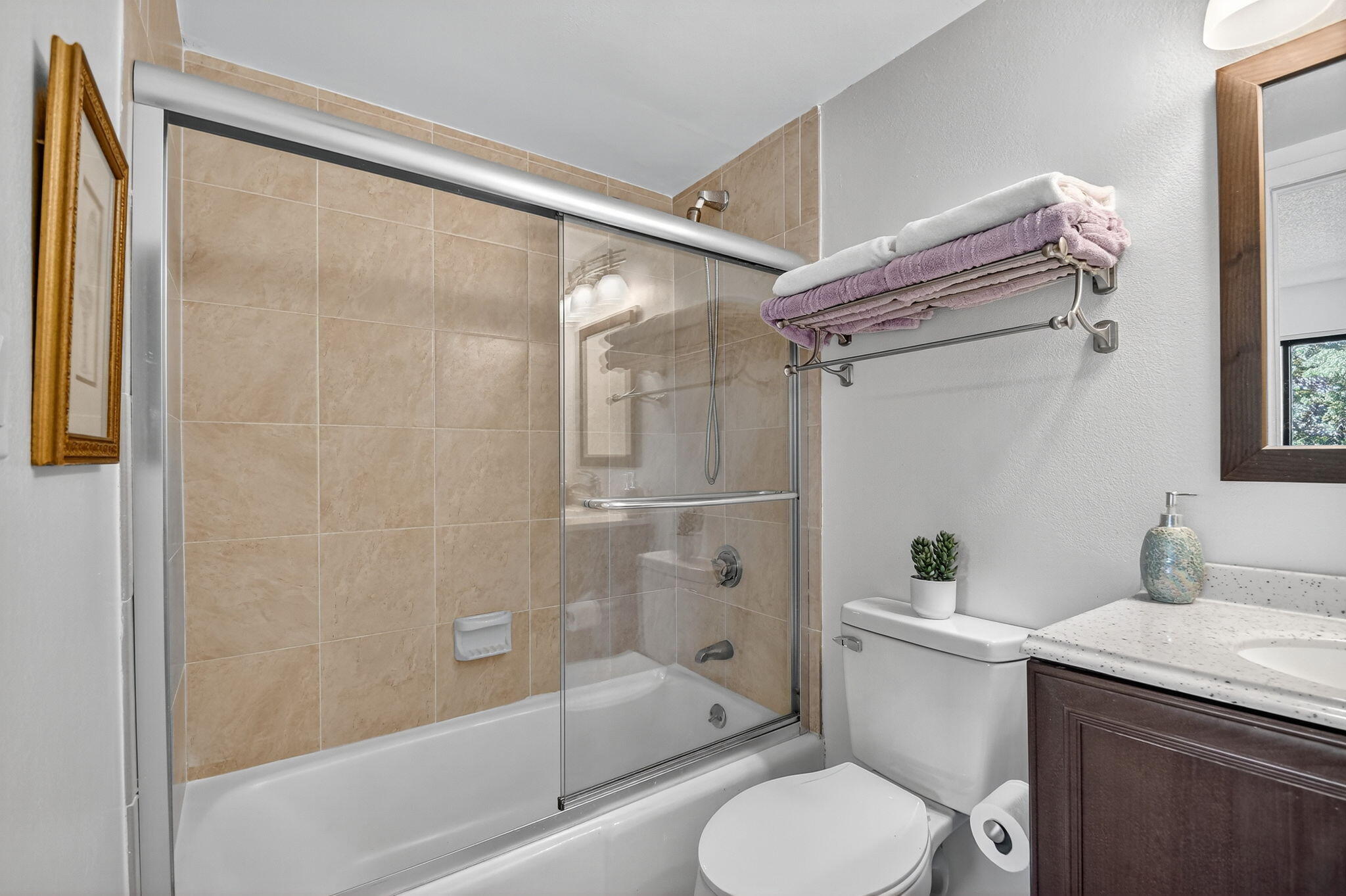 2500 Presidential Way, Unit 302 West Palm Beach, FL 33401 - Photo 27 of 52 a bathroom with a granite countertop bathtub shower sink mirror and toilet