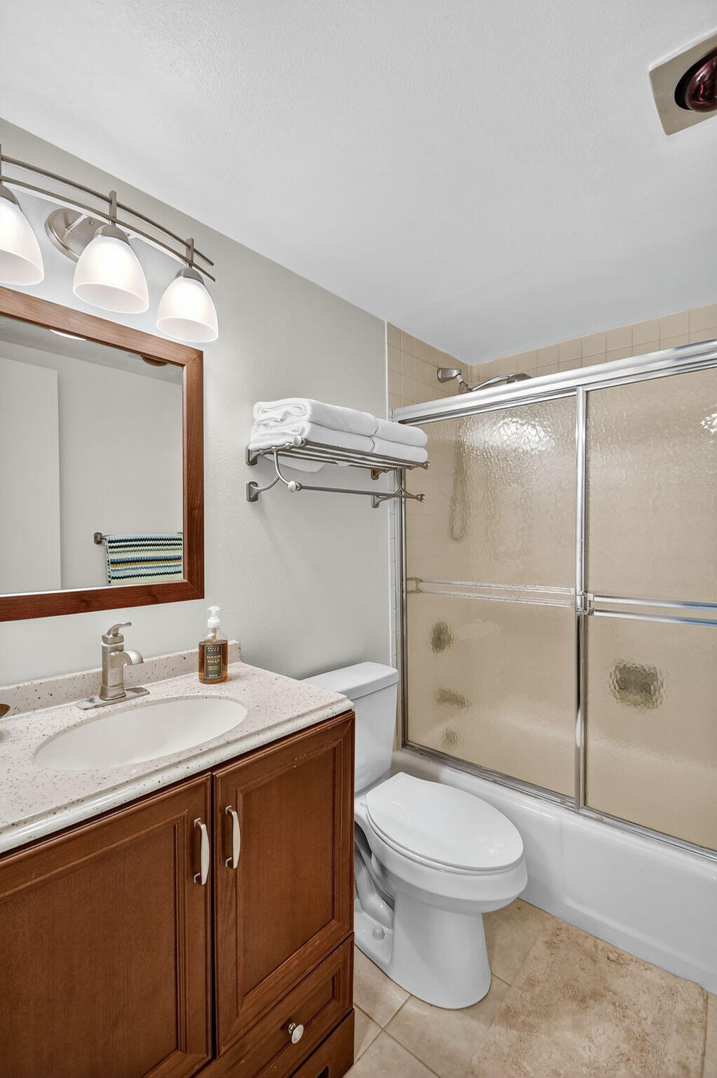 2500 Presidential Way, Unit 302 West Palm Beach, FL 33401 - Photo 34 of 52 a bathroom with a sink a toilet and shower