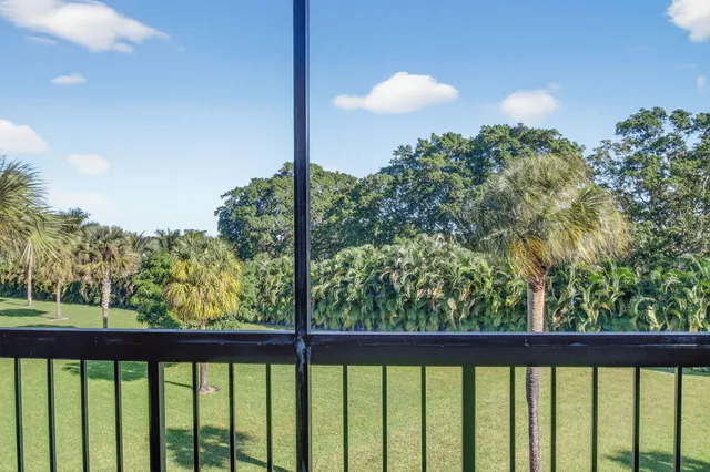 a view of a building with a yard