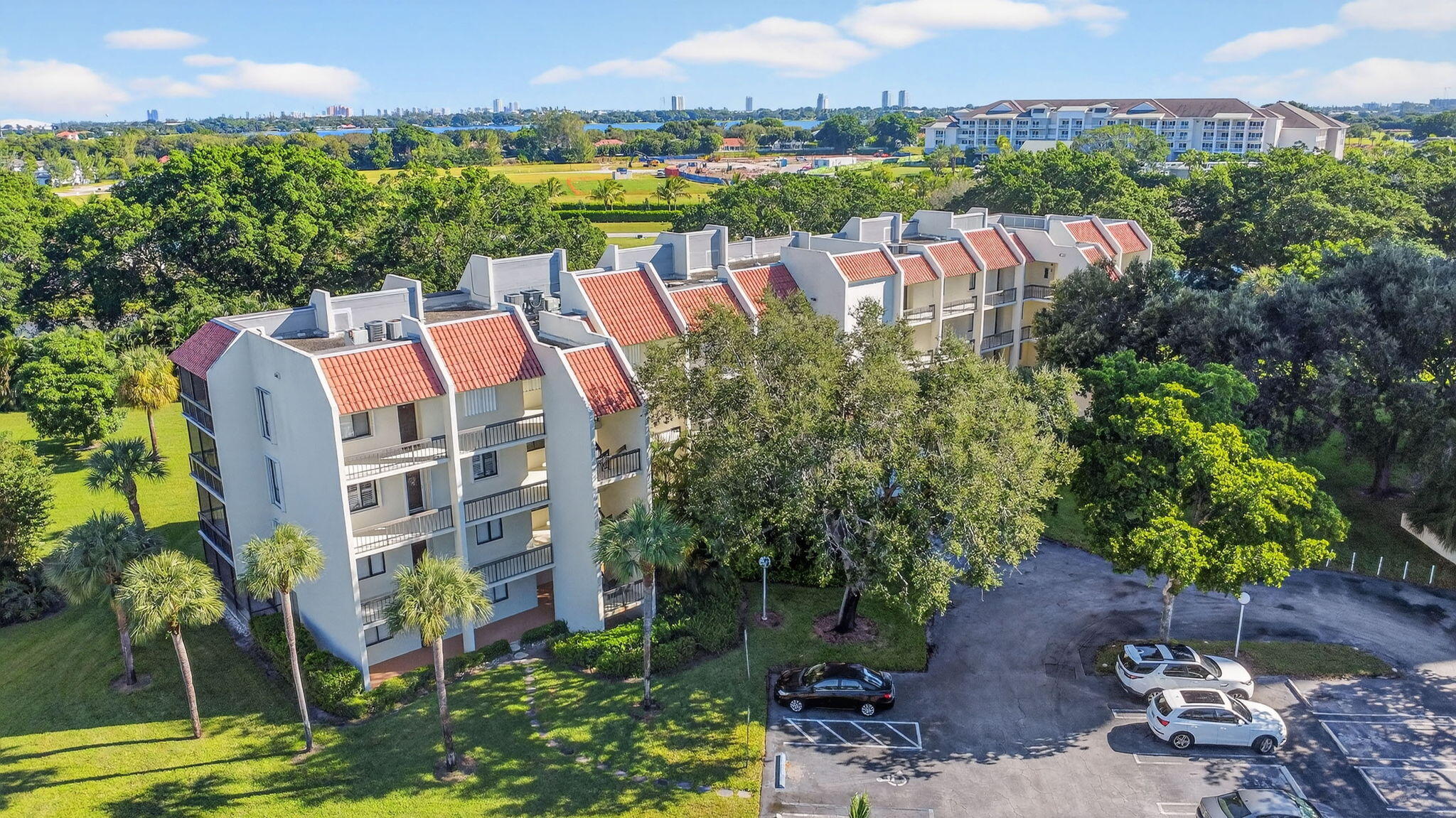 2500 Presidential Way, Unit 302 West Palm Beach, FL 33401 - Photo 40 of 52 a view of a lake with a building in the background