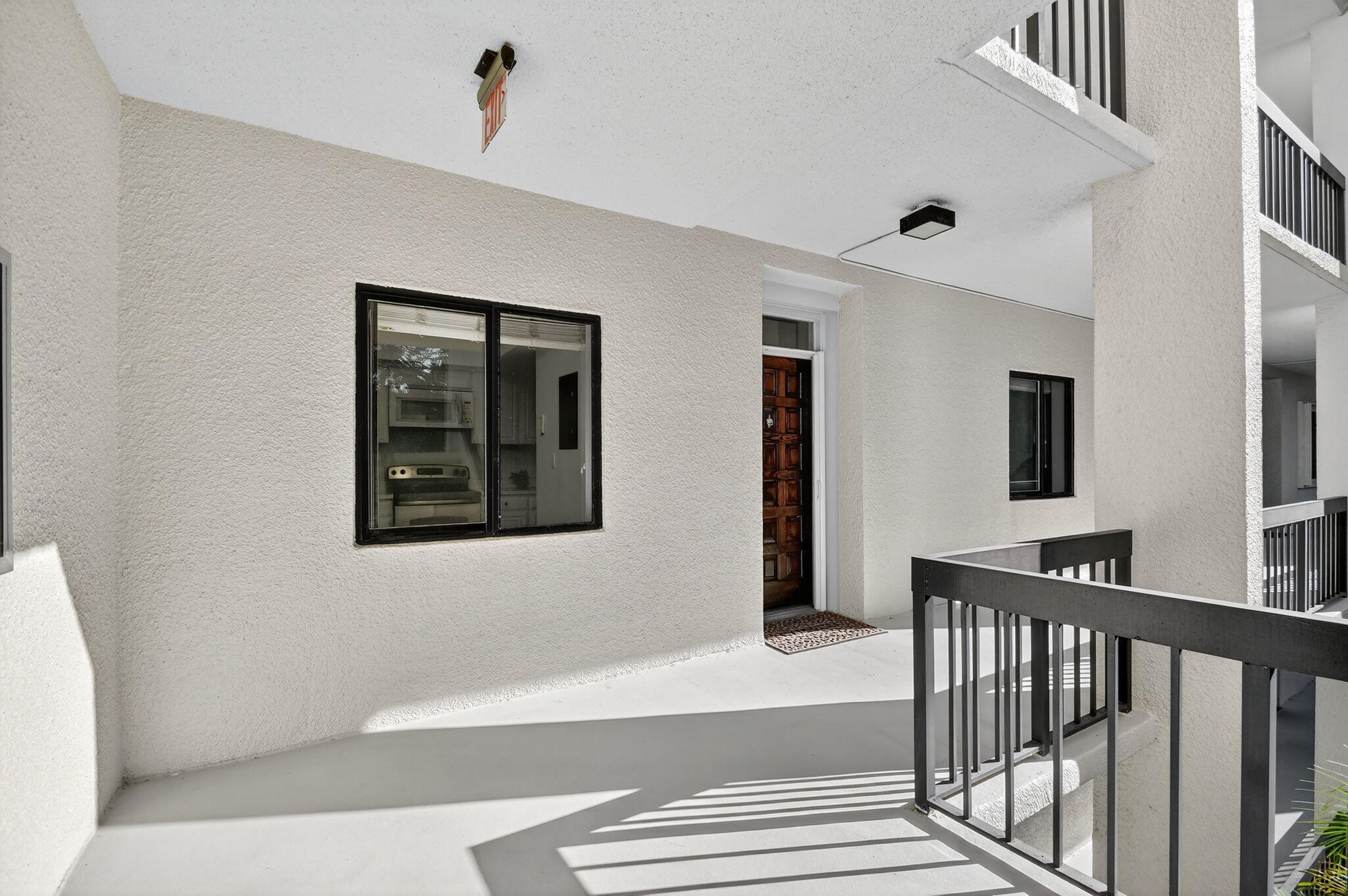 2500 Presidential Way, Unit 302 West Palm Beach, FL 33401 - Photo 4 of 52 a view of a hallway with entryway