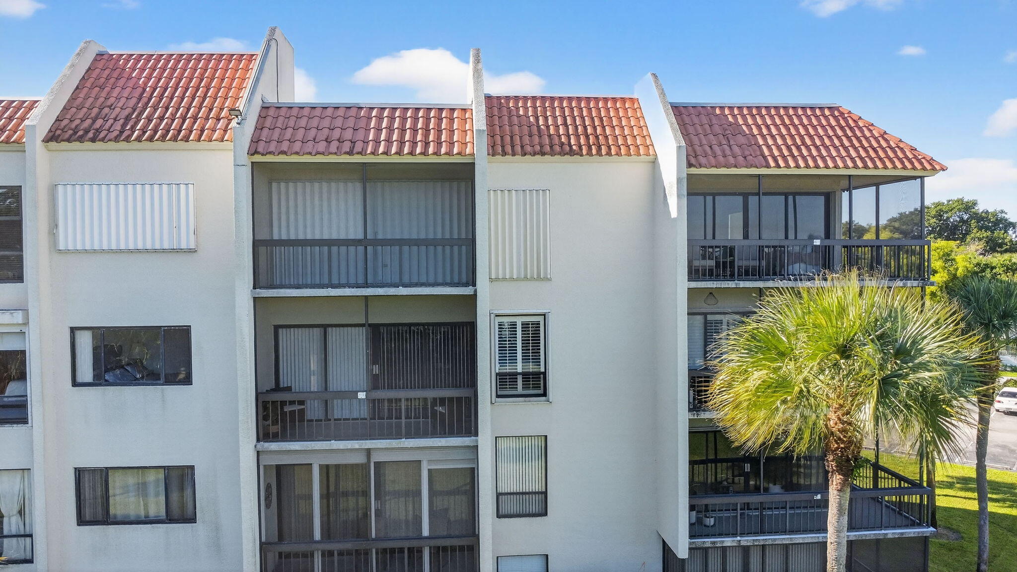 2500 Presidential Way, Unit 302 West Palm Beach, FL 33401 - Photo 50 of 52 a front view of a house with entryway