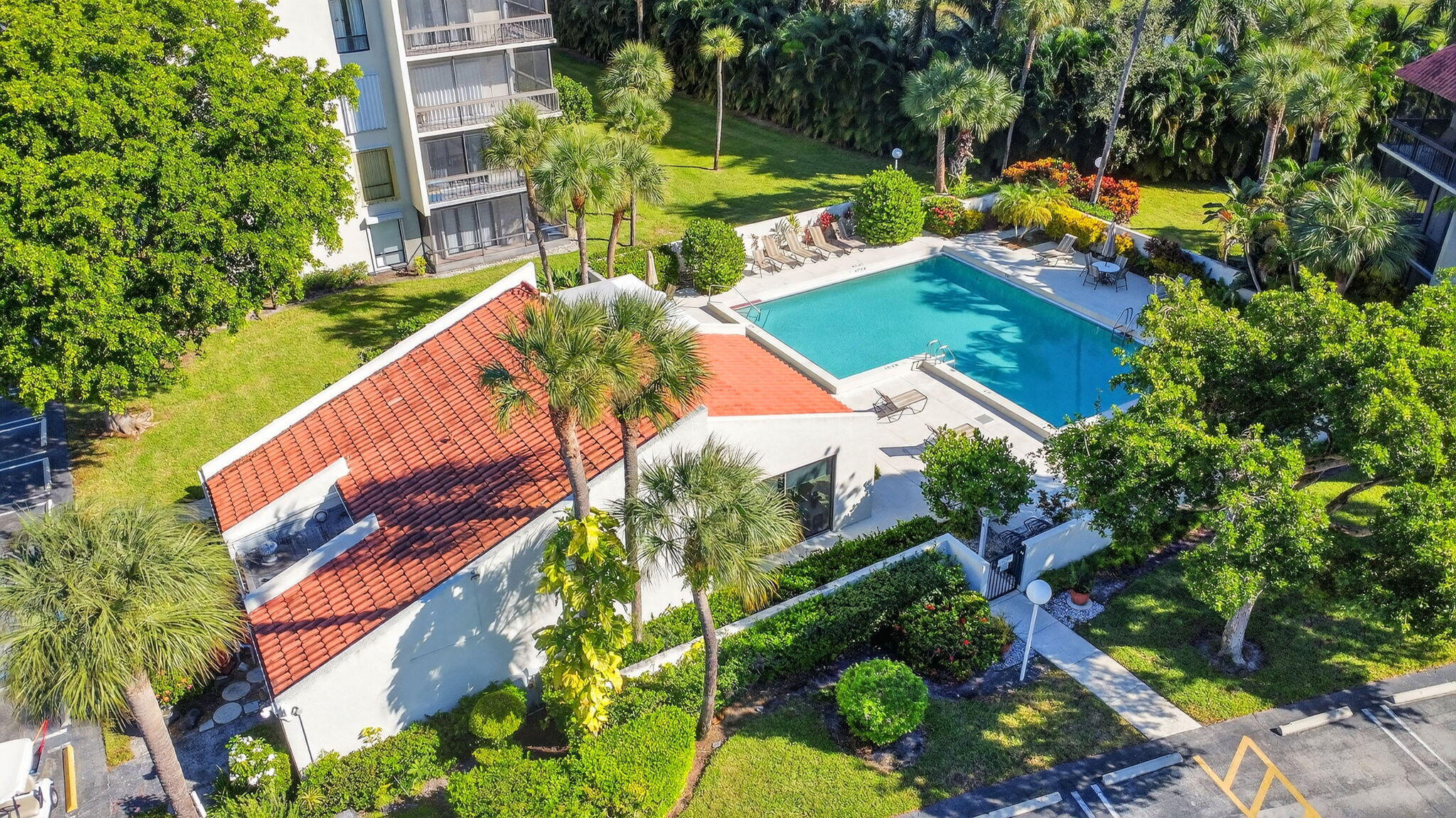 2500 Presidential Way, Unit 302 West Palm Beach, FL 33401 - Photo 52 of 52 an aerial view of a house with a yard and swimming pool