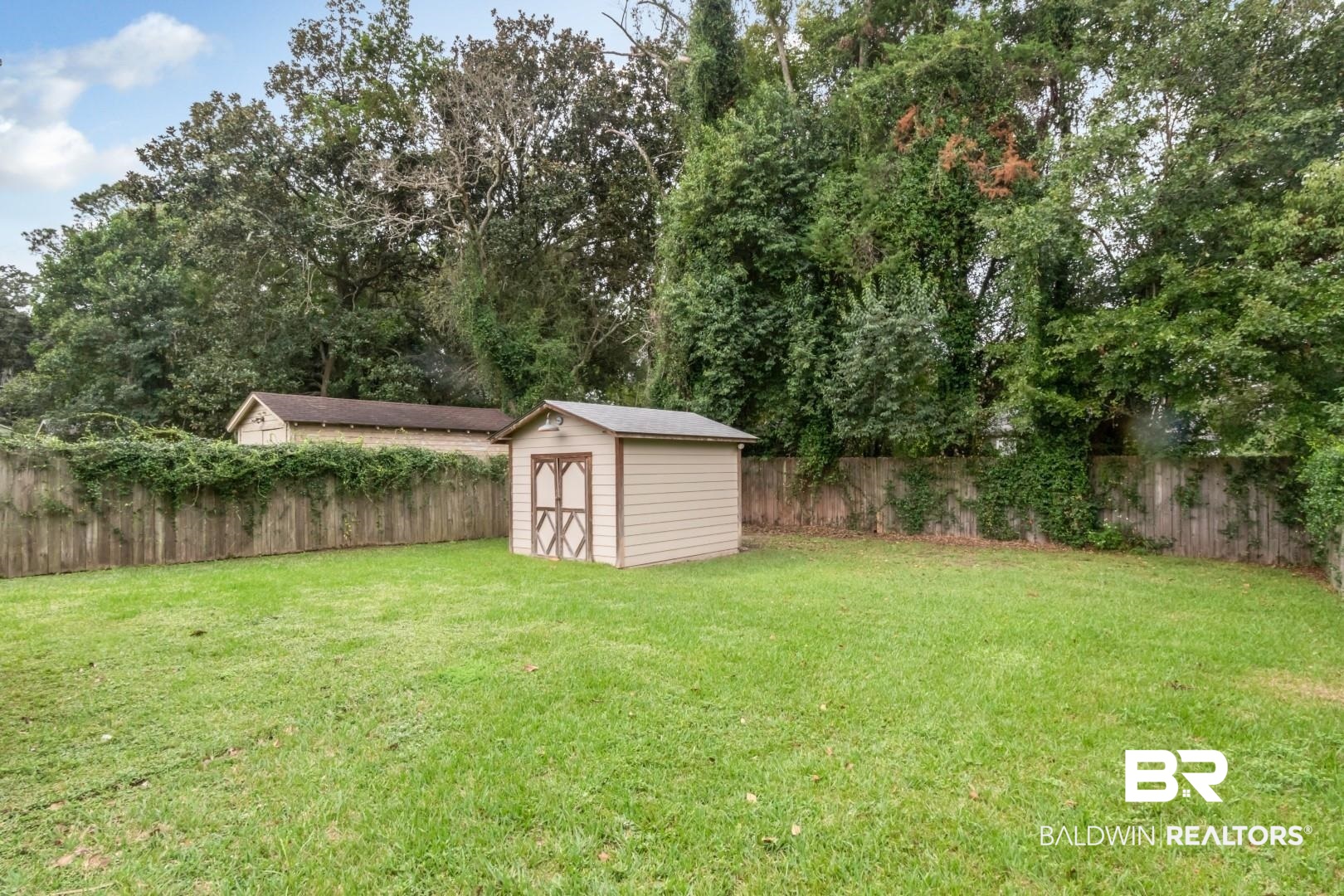 208 Morgan Avenue Mobile, AL 36606 - Photo 19 of 27 View of yard with a storage unit