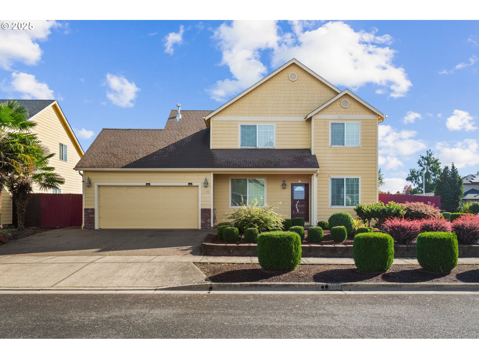 4199 Geranium Loop Northeast Salem, OR 97305 - Photo 1 of 43 a front view of a house with a yard and potted plants