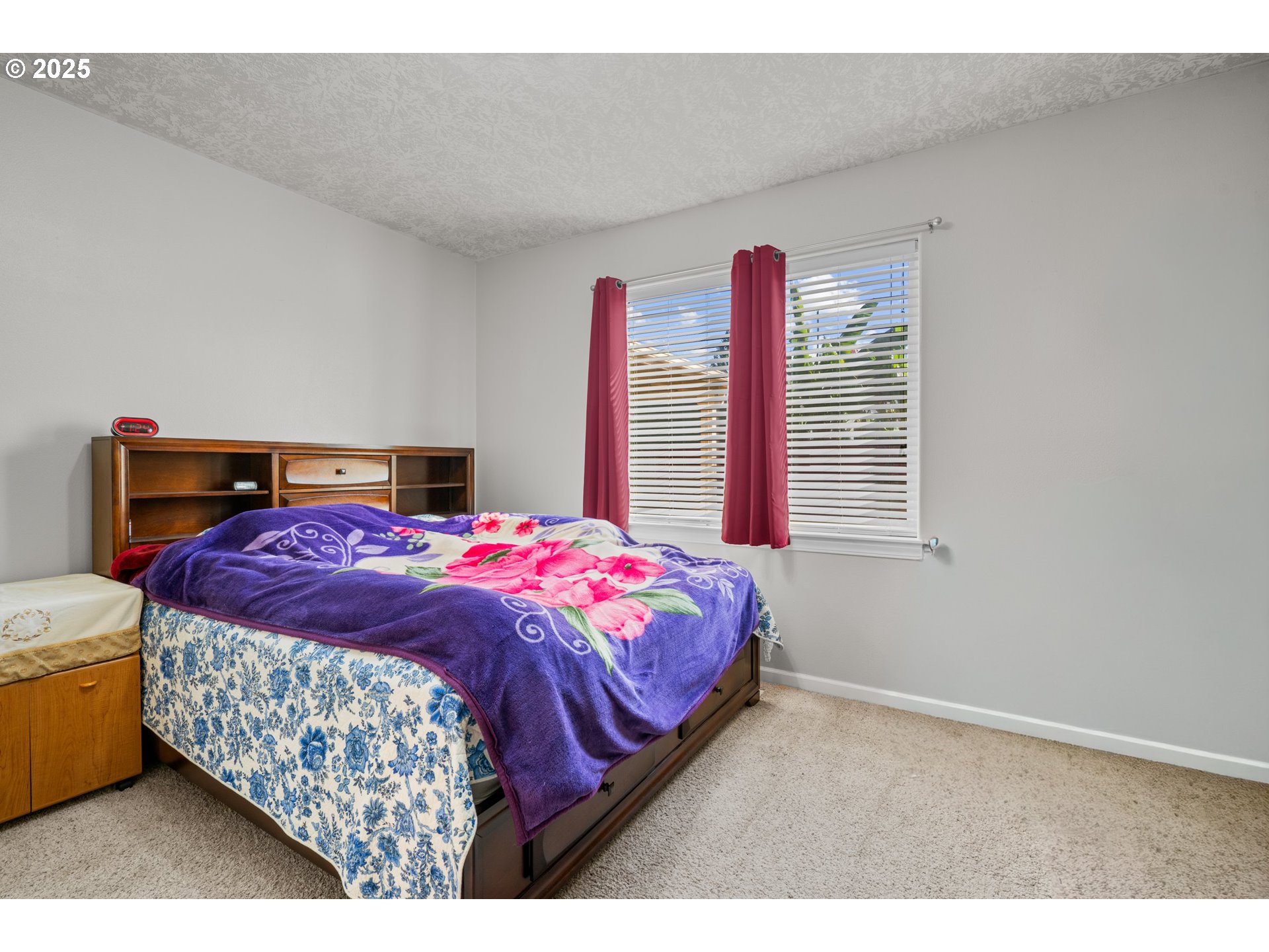 4199 Geranium Loop Northeast Salem, OR 97305 - Photo 17 of 43 a bedroom with a bed and a large window