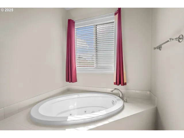 a bathroom with a sink and a window