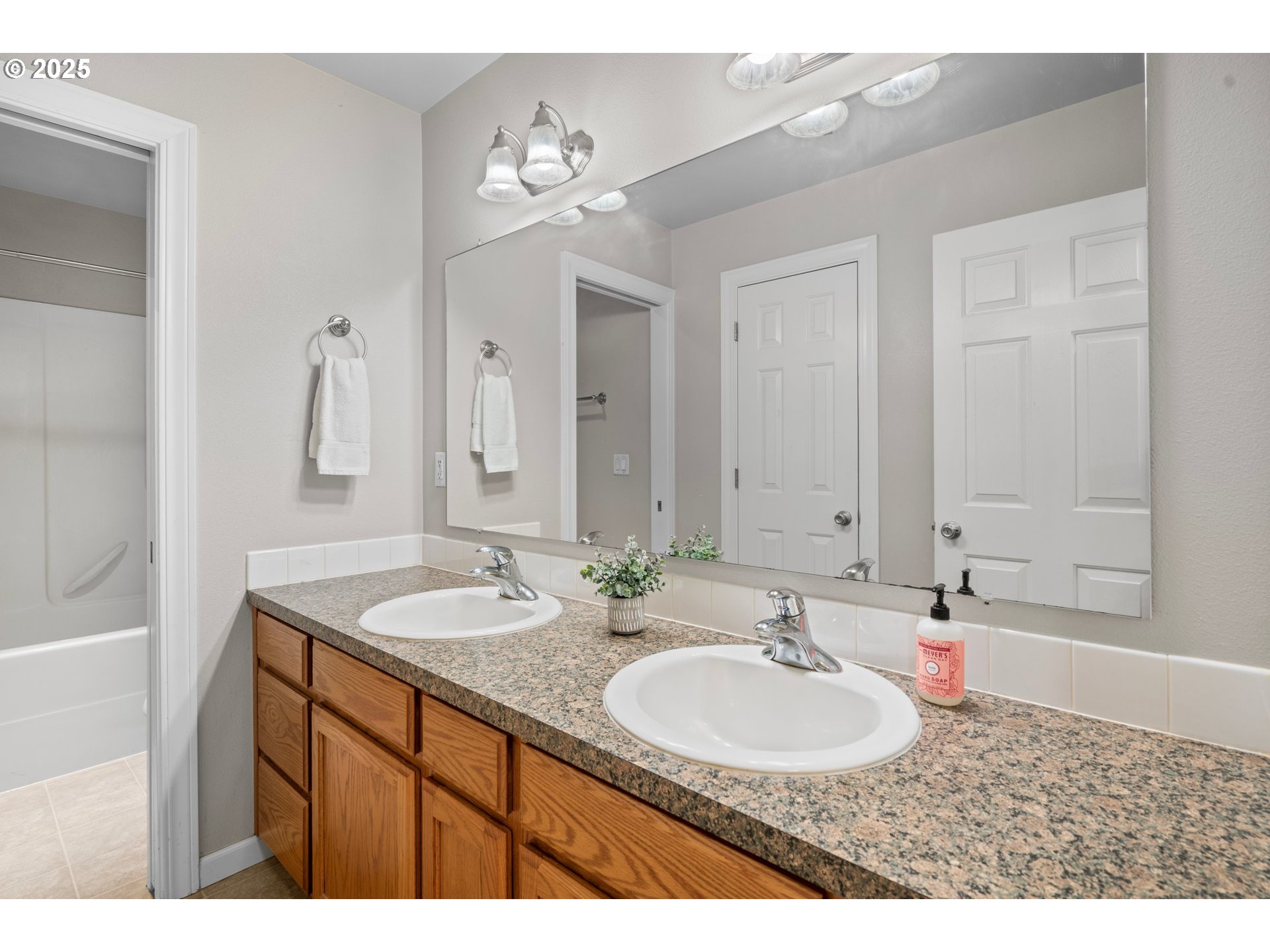 4199 Geranium Loop Northeast Salem, OR 97305 - Photo 26 of 43 a bathroom with a sink double vanity and a mirror