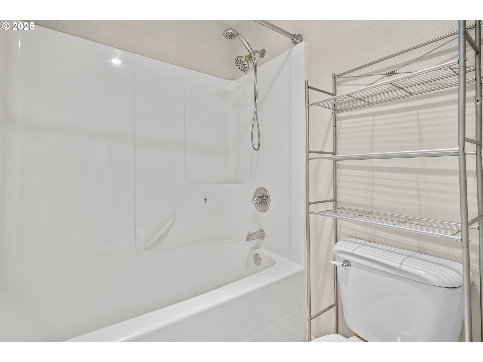 4199 Geranium Loop Northeast Salem, OR 97305 - Photo 27 of 43 a bathroom with a bathtub and a shower