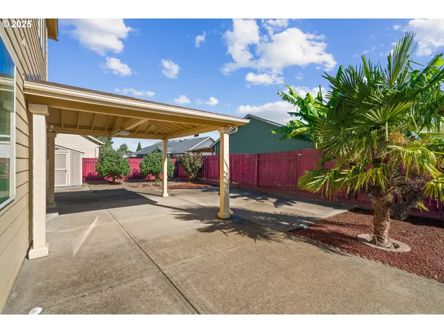 a view of a backyard of the house