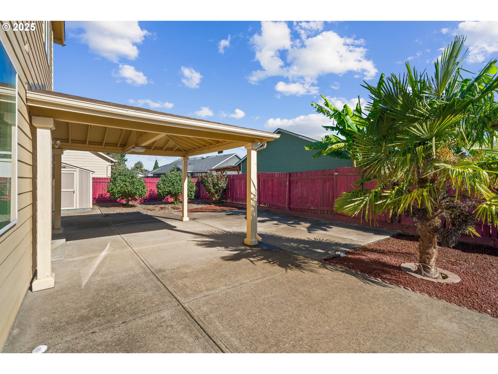 4199 Geranium Loop Northeast Salem, OR 97305 - Photo 38 of 43 a view of a patio with table and chairs with wooden fence