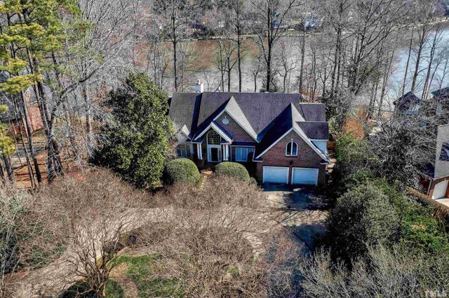 an aerial view of a house with a lake view