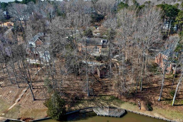 a view of a lake in middle of the forest