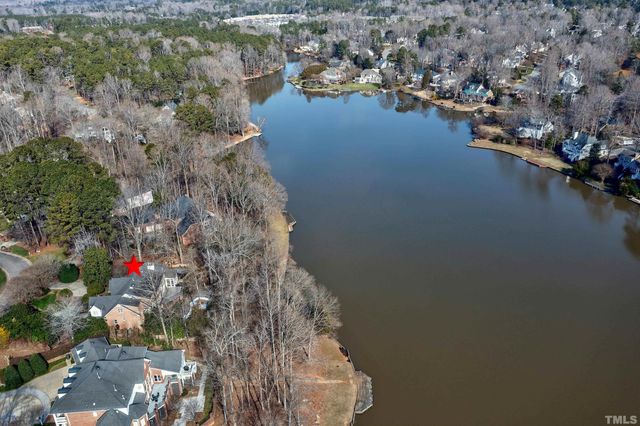 a view of a lake with outdoor seating