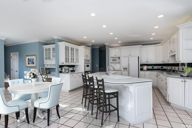 a view of a house with backyard and lake