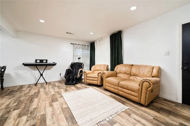 a living room with furniture and a rug