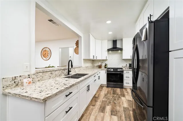 a kitchen with a sink stove and refrigerator