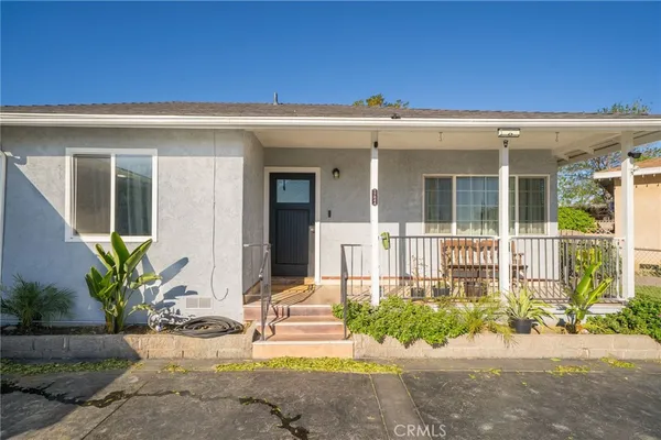 front view of a house with a small yard